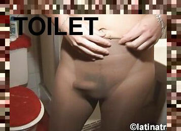 Mental T-girl Nikki Montero wearing pantyhose and pissing on herself at the toilet
