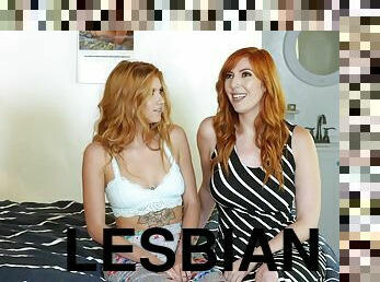 Two beautiful redhead lesbians licking passionately in bed