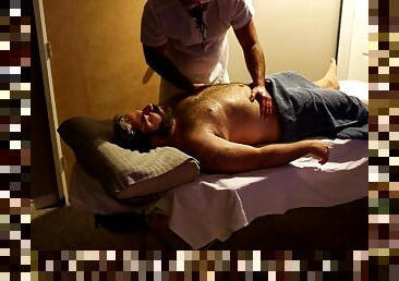 A rugby player gets hard during his massage