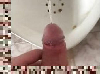 A guy pees in an office public toilet with his beautiful dick with big balls