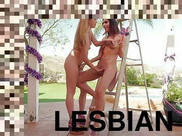 Two magnificent lesbians with natural tits having fun by the pool