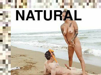 Inked hussy with big natural tits gets fucked on the beach