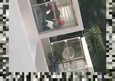 Neighbors caught having sex on balcony