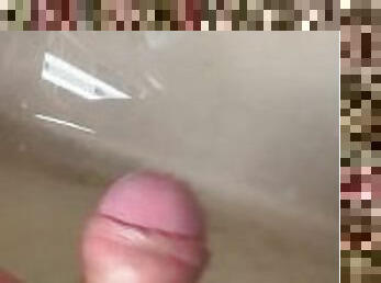 Soft Asian penis peeing in sink