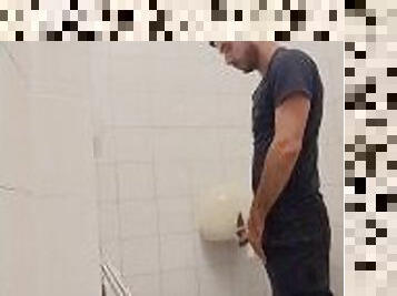 camera in the bathroom of a well-known company, man pisses with his Italian cock