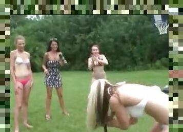 Bikini girls spinning and stripping in goofy outdoor video