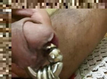 Teasing masturbation with pierced cock and balls