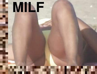 Chubby latina MILF on the beach voyeur video