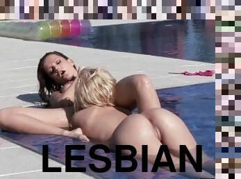 Beautiful lesbians get wet in the pool as well as thier pussies