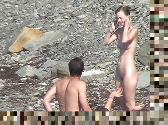 Sensual babe reveals her naked body on the beach