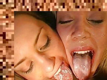 Two busty lesbians facialized with opened mouths