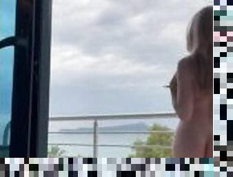 Teen blonde girl tempts neighbors in a hotel on the BALCONY by publicly flashing her body
