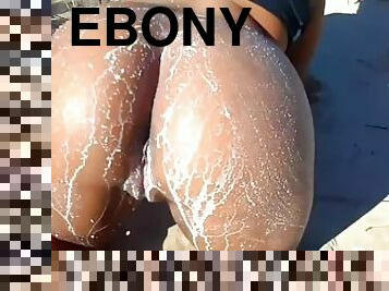 Ebony teen with fat ass and 38dd tits pours milk on ass