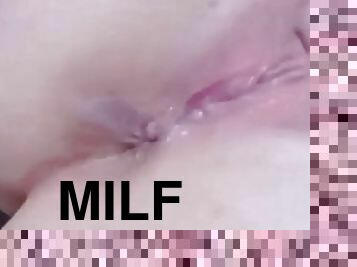 Sexy milf plays with her wet pussy