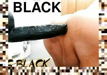 Huge Black dildo ride in a bathroom