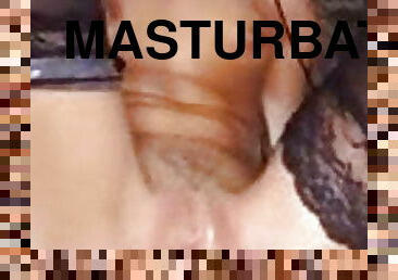 Masturbating