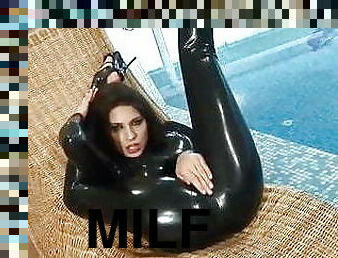 Flexible women in latex catsuit 