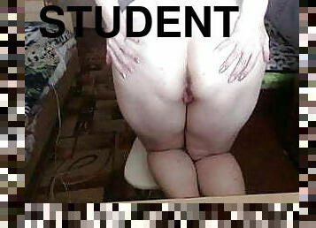 student in dorm on webcam