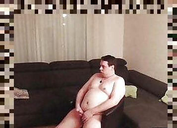 Fat guy masturbating on couch