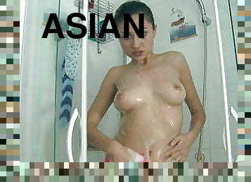 Asian chick Hujo Mujo masturbates in shower