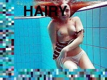 Cute hairy pussy teen Nina in the swimming pool