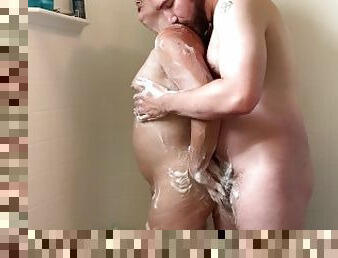 Wife gives passionate wet soapy handjob in the shower