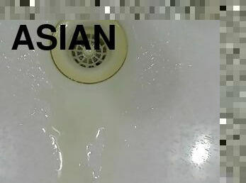 pissing in wash basin.