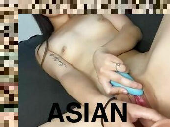 Asian girl fucks pussy with dildo till she creams