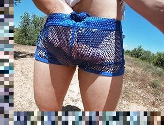 Sexy twink decides to go out for a walk in sheer shorts, then he flashes his hot boner
