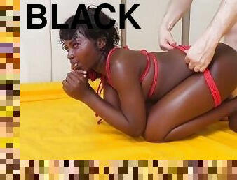 Tied up black slut gets spit on