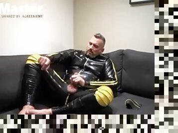 Man in rubber jerks uncut cock while making ASMR sounds and verbal PREVIEW