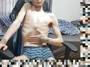 Extremely skinny teen oils up his body and shows his features