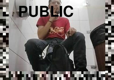 Smoking inside a public toilet