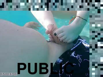 Underwater sex with footjob and nipple squeeze POV on a public beach