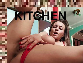 Sweet Josephine Jackson with big tits caresses her pussy in the kitchen