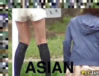 asian teens peeing on the street