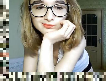 Cute teen Lina in glasses on webcam