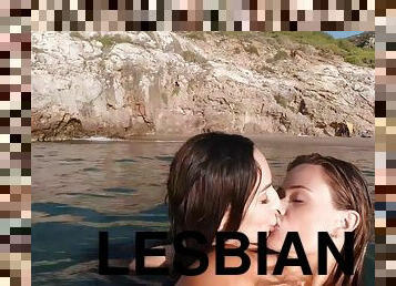 Lesbian lovers go swimming in the sea after having sex at the beach