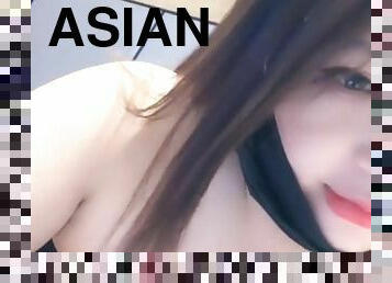 Naughty Asian brunette shows the beauty of her tits