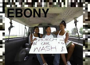 Ebony babes give lucky dude a double blowjob in a moving car