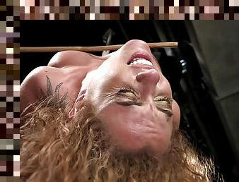 Curly redhead slave caned in hogtie