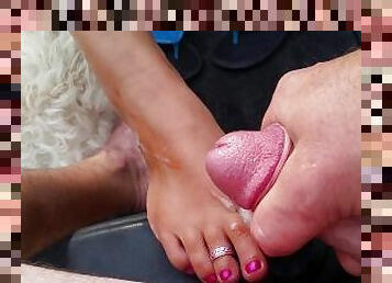 Pink tan toes on boat with nut
