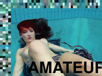 Redhead is katrin stripping underwater
