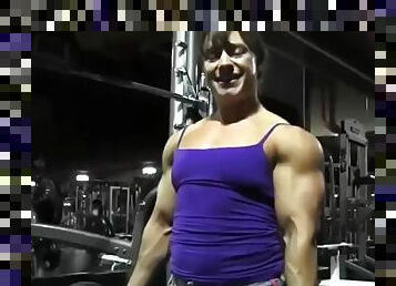 Muscle fbb RM workout in the gym flexing muscular woman
