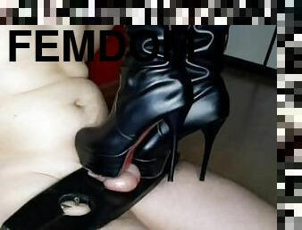 Trampling dick and balls with heels and slender legs in boots. Dominatrix Nika gets on her slave's d
