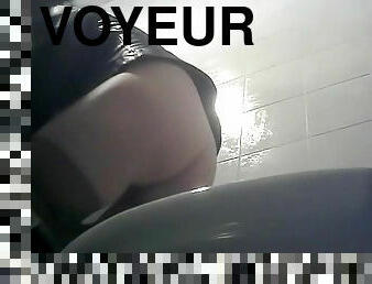Pissing video with a cute brunette in the voyeur toilet