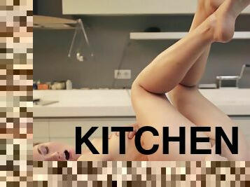 Petite beauty Selena B masturbates in the kitchen