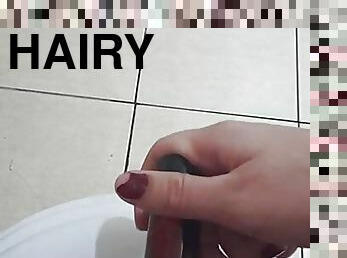HAIRY GIRL MASTURBATING WITH WATER AND BOTTLE