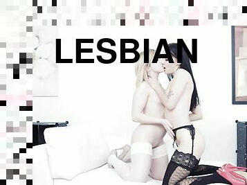 Lesbians pose nude and touch one another in sensual modes
