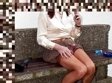 Slut on offer - in a transparent pleated miniskirt and nylon stockings
